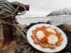 Wafle with cloudberries and wipped cream by the sea