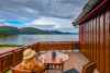 Lady on balcony with a fjod view