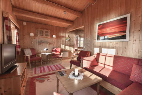 The living room has a logg style room construction