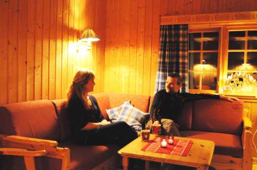 Two persons in the living room in the family cabin