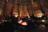 People around the fireplace in the lavvo