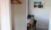 Entrance and the dining area in the studio cabin
